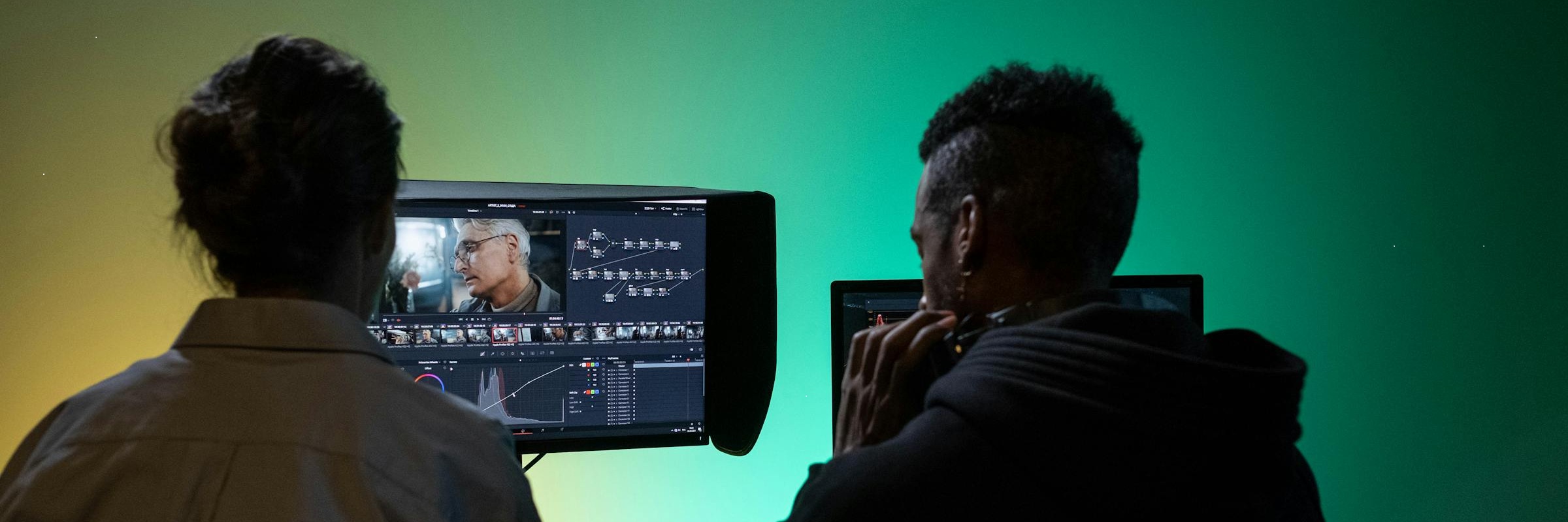 Two students editing a video