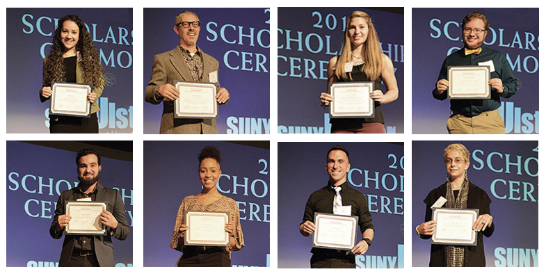 students holding awards on stage at scholarship ceremony