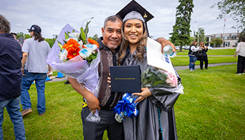 student and father at graduation