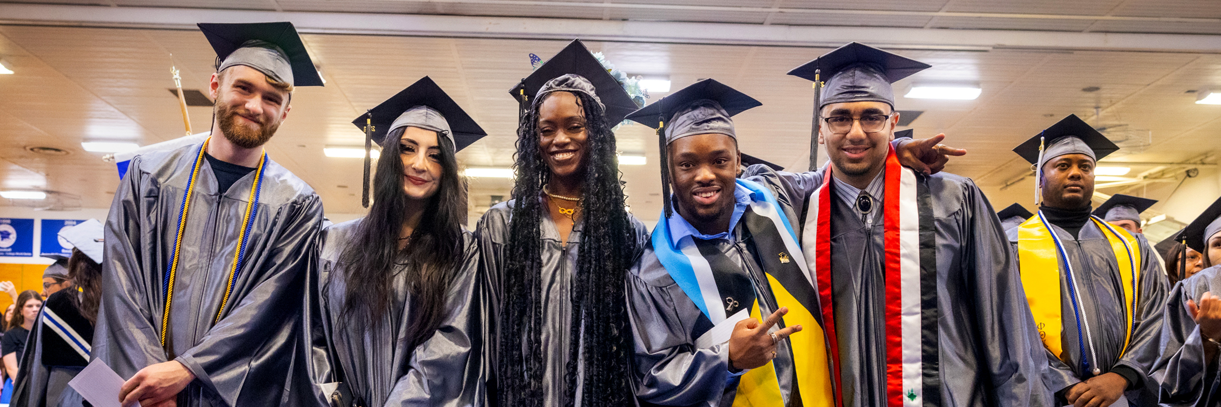 diverse group of young graduates at 2024 commencement ceremony