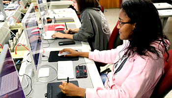 student using computer in classroom