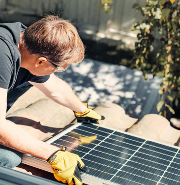 man with solar panels