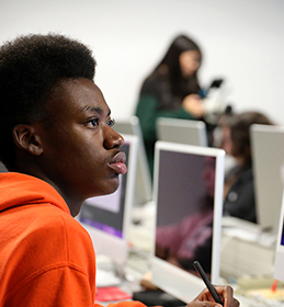 student with computer