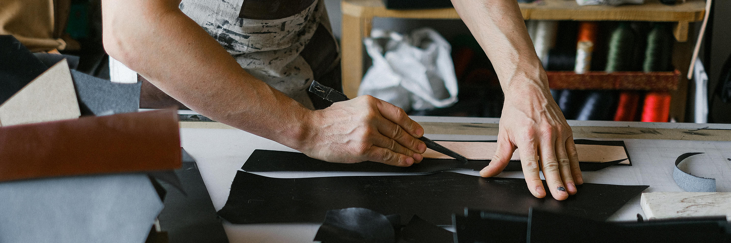 workshop with hands, scissors and fabric