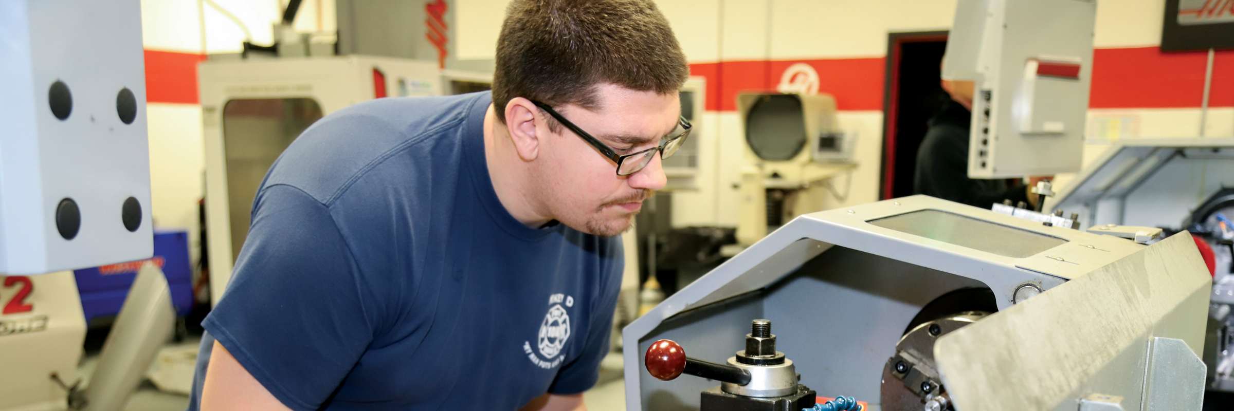 man looking closely at equipment