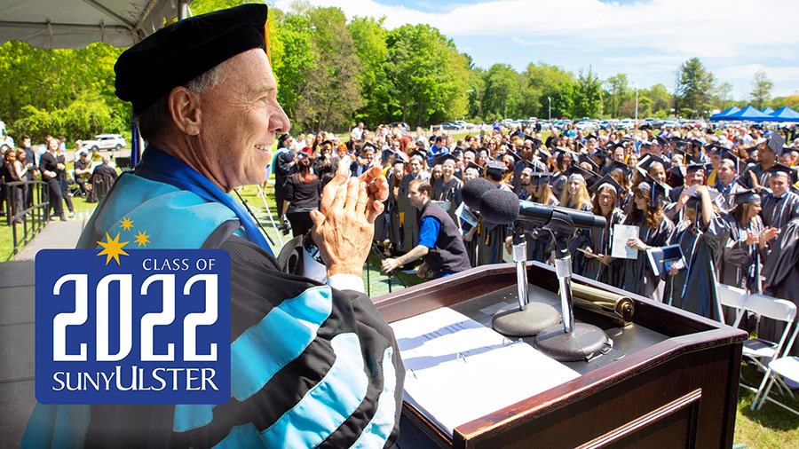 president emeritus roberts with crowd outside at 2022 grad ceremony