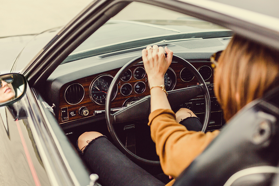 classic car with woman driving