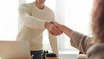 handshake over desk