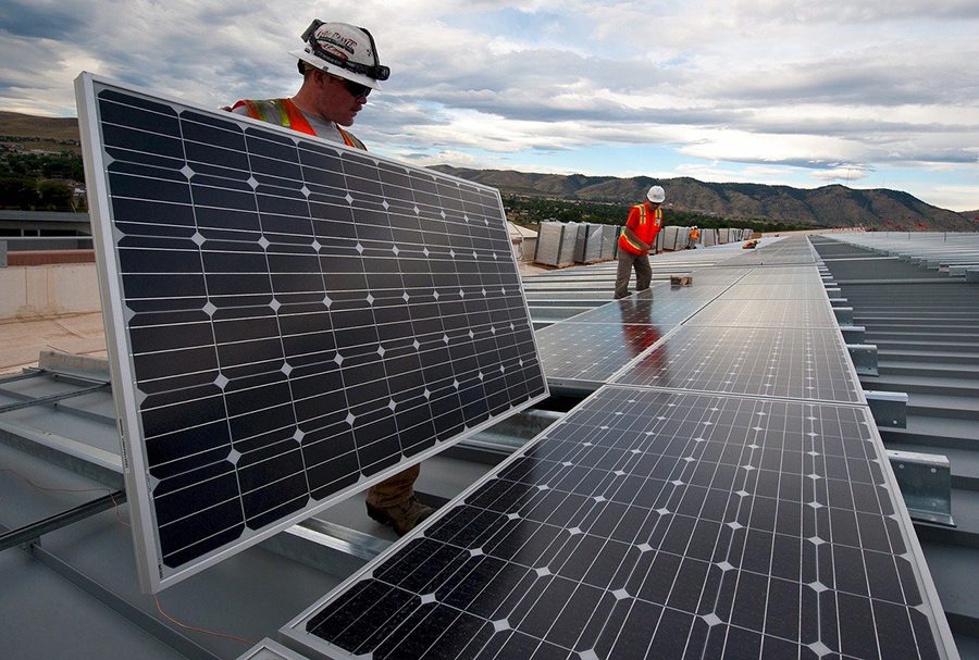 workers with solar panels