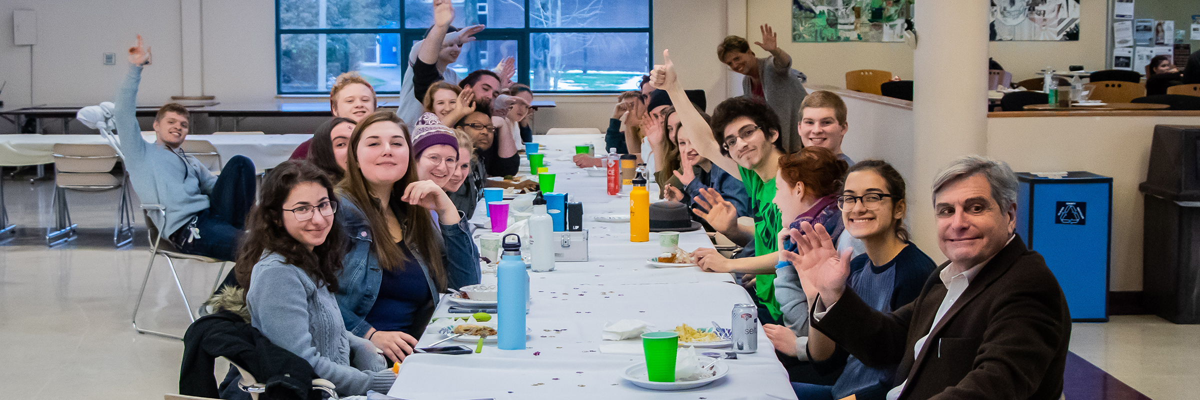 pridesgiving event- diverse students and staff at cafeteria table