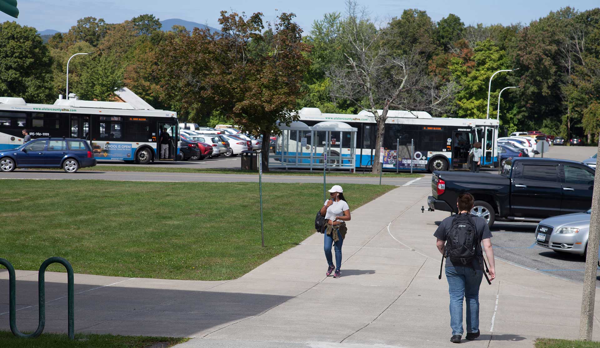 campus view with students and busses