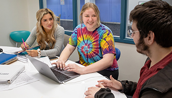 three white students talking during study group