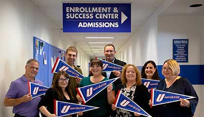 enrollment and success team employees posing together